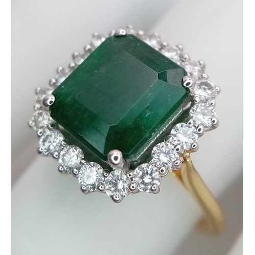 296 - A Head Turning 950 Platinum and 18K Yellow Gold (tested) Emerald with Diamond Surround Dress Ring. 4... 