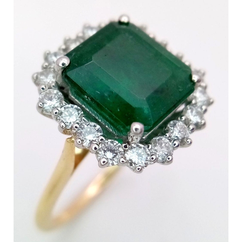 296 - A Head Turning 950 Platinum and 18K Yellow Gold (tested) Emerald with Diamond Surround Dress Ring. 4... 