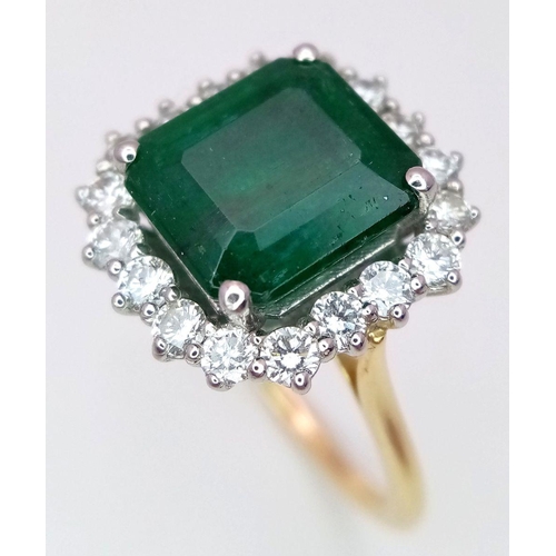 296 - A Head Turning 950 Platinum and 18K Yellow Gold (tested) Emerald with Diamond Surround Dress Ring. 4... 