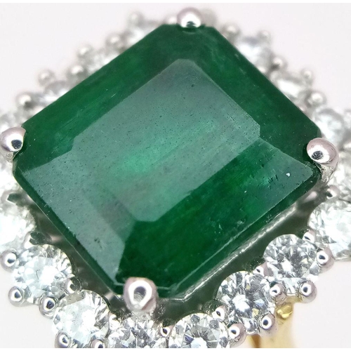 296 - A Head Turning 950 Platinum and 18K Yellow Gold (tested) Emerald with Diamond Surround Dress Ring. 4... 