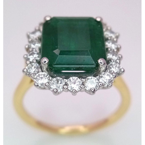 296 - A Head Turning 950 Platinum and 18K Yellow Gold (tested) Emerald with Diamond Surround Dress Ring. 4... 
