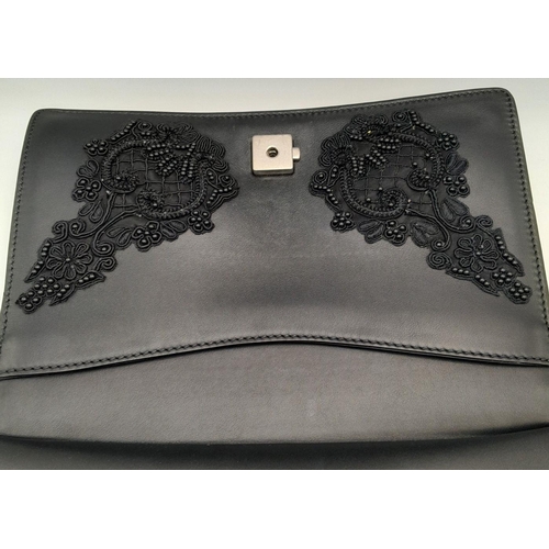 162 - A Gucci Dionysus Embroidered Shoulder Bag. Black leather exterior with silver-toned tiger head spur ... 