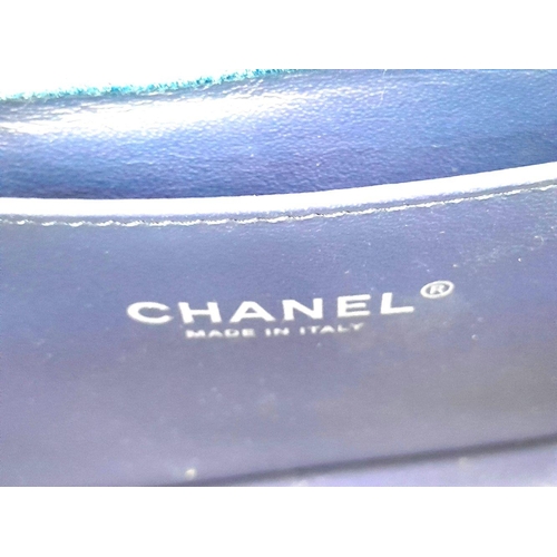 31 - A Chanel Navy Tweed and Leather Boy Bag. Tweed and leather exterior with silver-tone chain and leath... 