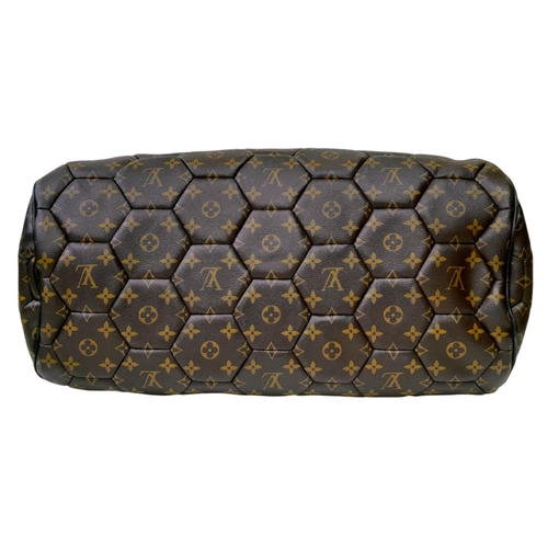 38 - A Louis Vuitton Monogram Hexagone Keepall Bandouliere Bag. Monogram-coated canvas exterior with hexa... 