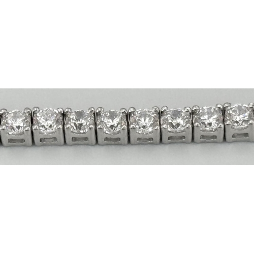 479 - A 925 Silver White Zircon Tennis Bracelet. 17cm. 10.66g.