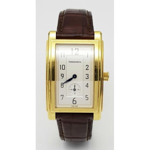 55 - A Tiffany and Co. 18K Gold Grand Resonator Ladies Watch. Brown leather strap with 18K gold clasp. 18... 