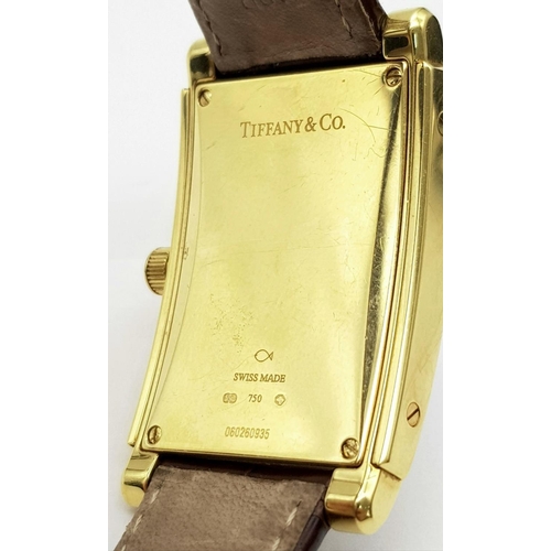 55 - A Tiffany and Co. 18K Gold Grand Resonator Ladies Watch. Brown leather strap with 18K gold clasp. 18... 