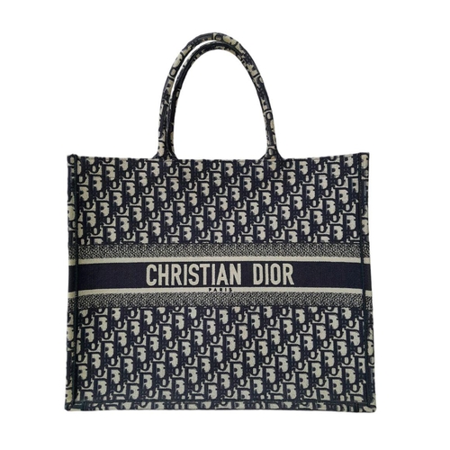 73 - A Christian Dior Blue and White Book Tote Bag. Monogram canvas exterior with dual top handles and op... 