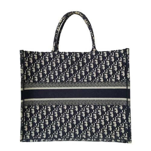 73 - A Christian Dior Blue and White Book Tote Bag. Monogram canvas exterior with dual top handles and op... 