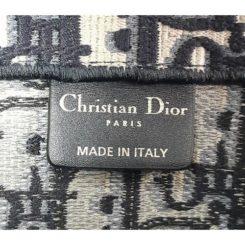 73 - A Christian Dior Blue and White Book Tote Bag. Monogram canvas exterior with dual top handles and op... 