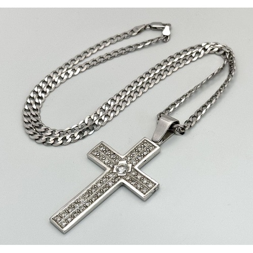 480 - A Serious 9k White Gold Diamond Encrusted Cross on a 9K White Gold Curb Chain. Cross - 7cm x 4cm. Ch... 