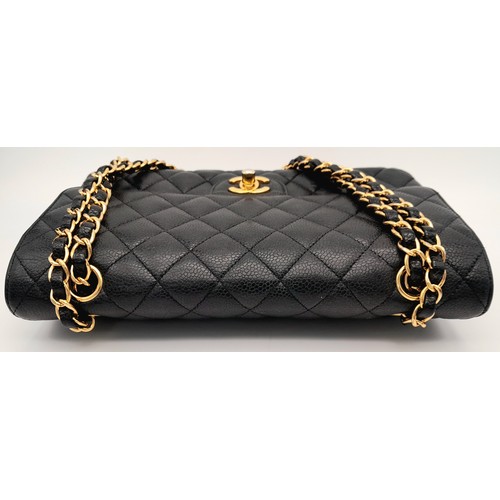 65 - A Chanel Black Quilted Classic Flap Bag. Leather exterior with gold-toned hardware and a flap closur... 