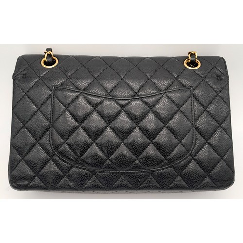 65 - A Chanel Black Quilted Classic Flap Bag. Leather exterior with gold-toned hardware and a flap closur... 