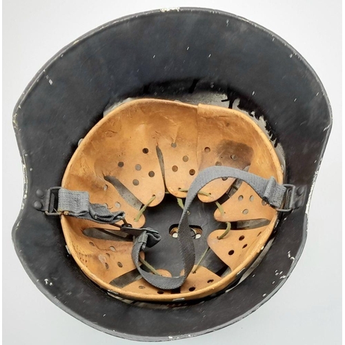 1338 - A Repainted German Army Parade Helmet with Original Liner.
