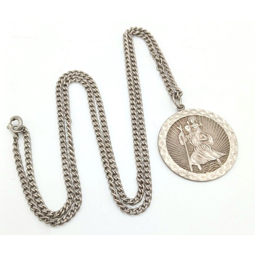 1541 - A vintage sterling silver St Christopher pendant on silver chain. Total weight 14.15G. Total length ... 