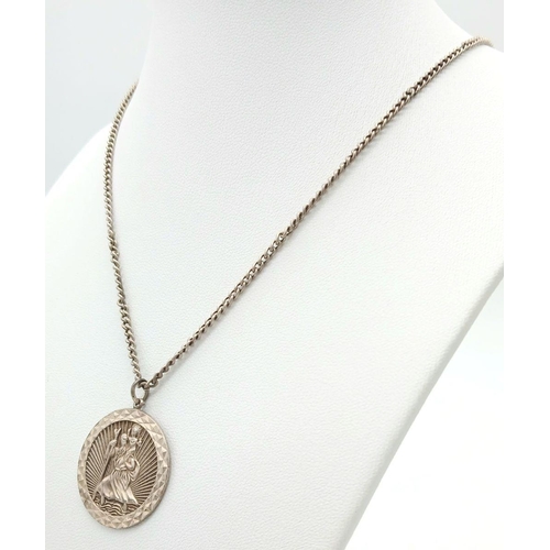 1541 - A vintage sterling silver St Christopher pendant on silver chain. Total weight 14.15G. Total length ... 