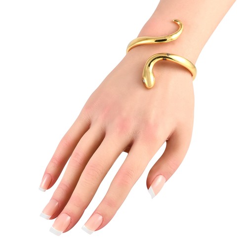 24 - A Ilias Lalaounis 18K Yellow Gold Snake Bracelet. A sleek serpentine design makes this Ilias Lalaoun... 