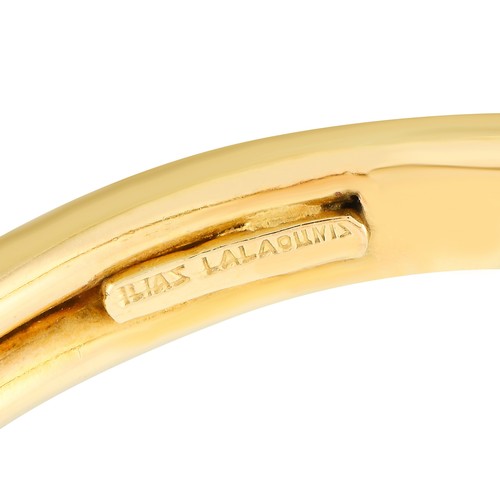 24 - A Ilias Lalaounis 18K Yellow Gold Snake Bracelet. A sleek serpentine design makes this Ilias Lalaoun... 