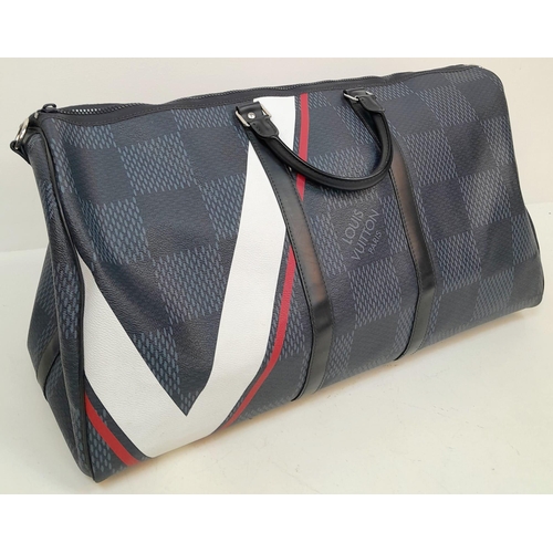 16 - A Louis Vuitton America's Cup Oversized Keepall. Damier canvas in dark blue with a 'V' Gaston logo -... 