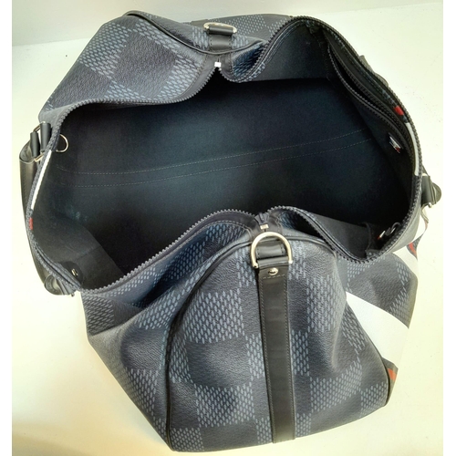 16 - A Louis Vuitton America's Cup Oversized Keepall. Damier canvas in dark blue with a 'V' Gaston logo -... 