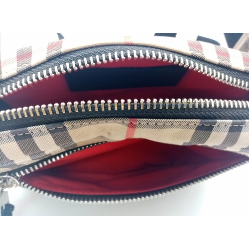 227 - A Burberry canvas bum bag (fanny pack), Silver top zip plus additional zipped pouch to front, adjust... 