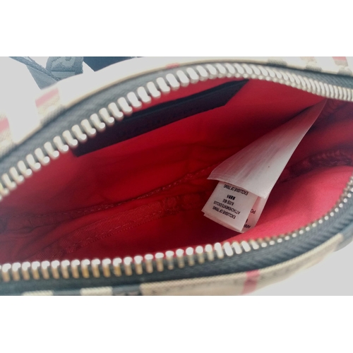 227 - A Burberry canvas bum bag (fanny pack), Silver top zip plus additional zipped pouch to front, adjust... 