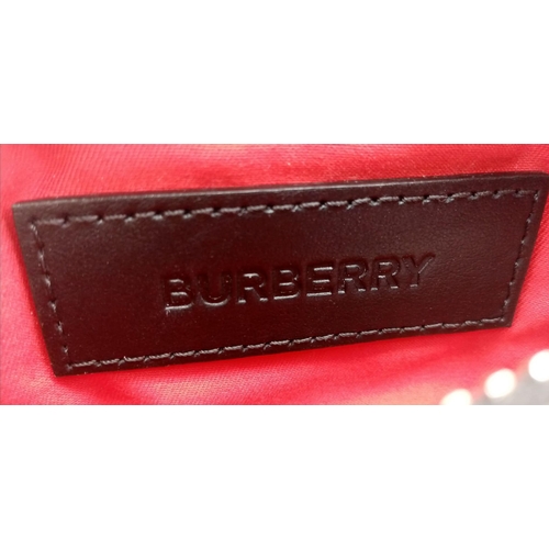 227 - A Burberry canvas bum bag (fanny pack), Silver top zip plus additional zipped pouch to front, adjust... 