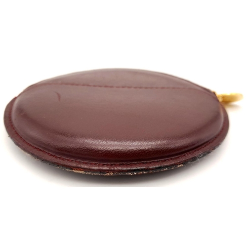 234 - A Burgundy Cartier Purse. Leather exterior, zipper closure, gold-tone hardware and a open side pocke... 
