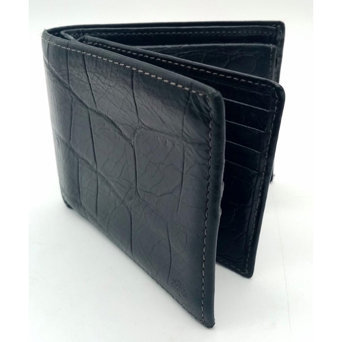 199 - A black leather Mulberry wallet, can hold up to 8 cards, includes a coin pouch. Size approx. 11x9cm.... 