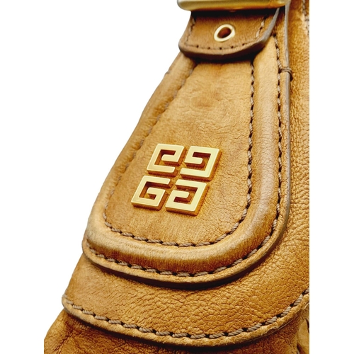 220 - A Givenchy Brown Eclipse Hobo Bag. Leather exterior, gold-toned hardware, adjustable handle strap, o... 