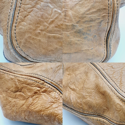 220 - A Givenchy Brown Eclipse Hobo Bag. Leather exterior, gold-toned hardware, adjustable handle strap, o... 