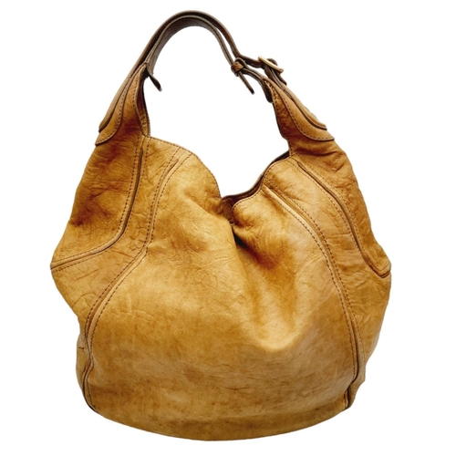 220 - A Givenchy Brown Eclipse Hobo Bag. Leather exterior, gold-toned hardware, adjustable handle strap, o... 