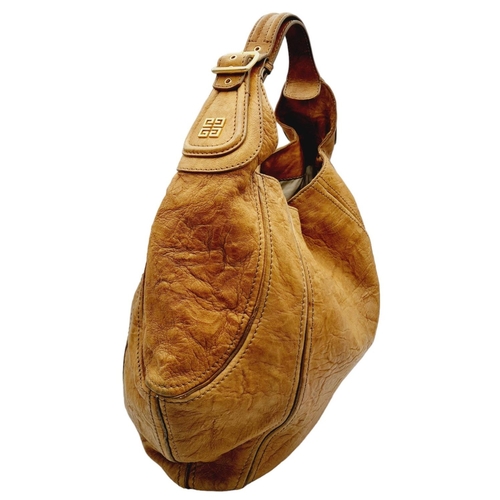 220 - A Givenchy Brown Eclipse Hobo Bag. Leather exterior, gold-toned hardware, adjustable handle strap, o... 