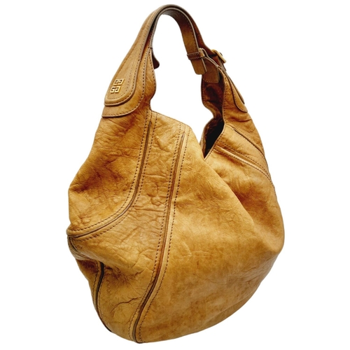220 - A Givenchy Brown Eclipse Hobo Bag. Leather exterior, gold-toned hardware, adjustable handle strap, o... 