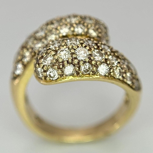 156 - An 18K Yellow Gold Diamond Wrap Ring. 1.50ctw round brilliant cut natural diamonds - colour I - J, c... 