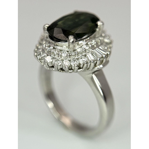 170 - A 900 Platinum Green Sapphire with Diamond Surround Dress Ring. A 2.11ct cushion mixed cut green sap... 