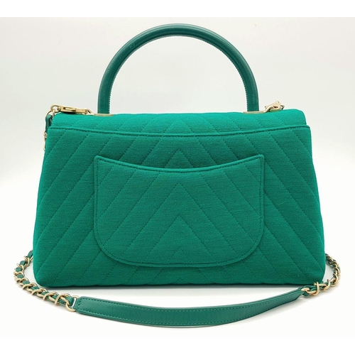 599 - A Chanel Coco Handle Cloth Handbag in Green Chevron Canvas. Chevron canvas exterior with gold-toned ... 