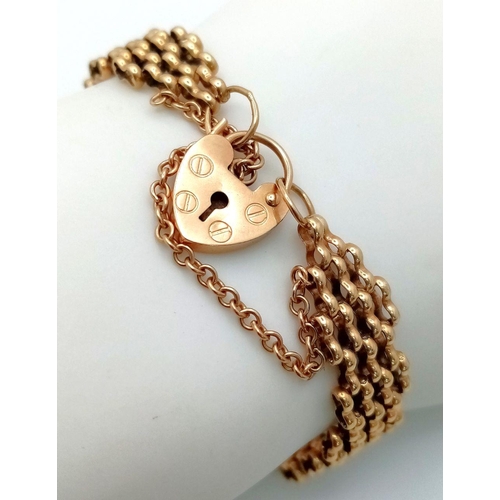 10 - A Vintage 9K Yellow Gold Gate Bracelet with Heart Clasp. 18cm. 12g weight.