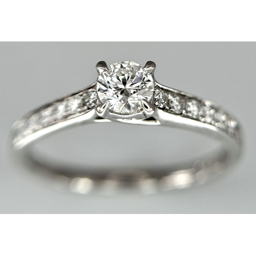 109 - AN 18K WHITE GOLD DIAMOND SOLITAIRE - WITH DIAMOND SHOULDERS RING. 0.25CT MAIN STONE WITH 0.24CT SHO... 