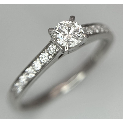 109 - AN 18K WHITE GOLD DIAMOND SOLITAIRE - WITH DIAMOND SHOULDERS RING. 0.25CT MAIN STONE WITH 0.24CT SHO... 