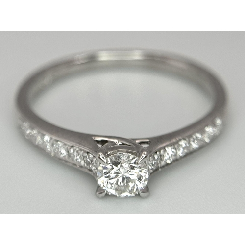 109 - AN 18K WHITE GOLD DIAMOND SOLITAIRE - WITH DIAMOND SHOULDERS RING. 0.25CT MAIN STONE WITH 0.24CT SHO... 