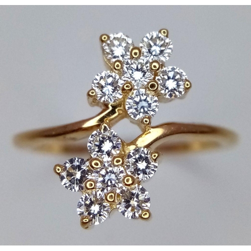 137 - A 14K YELLOW GOLD DOUBLE FLOWER DIAMOND CLUSTER RING. 0.50CT. 3.6G. SIZE L. GW 3006.