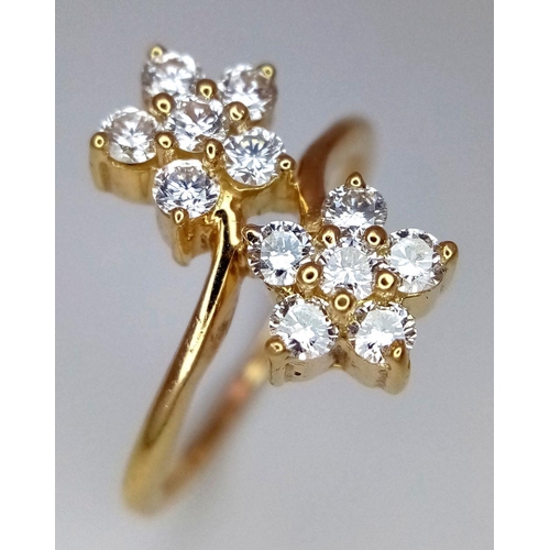 137 - A 14K YELLOW GOLD DOUBLE FLOWER DIAMOND CLUSTER RING. 0.50CT. 3.6G. SIZE L. GW 3006.