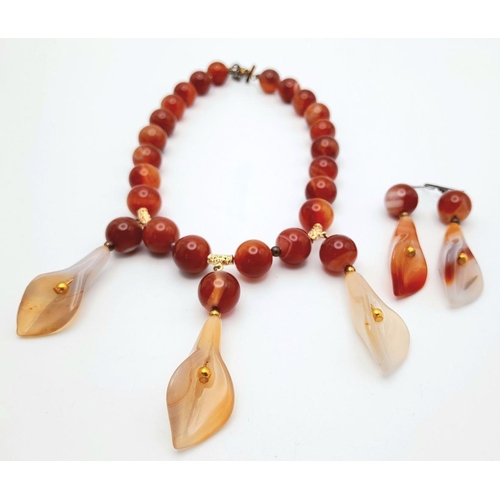 140 - A vintage carnelian necklace and earrings set with carved Arum lilies pendants (often cale Cala lili... 