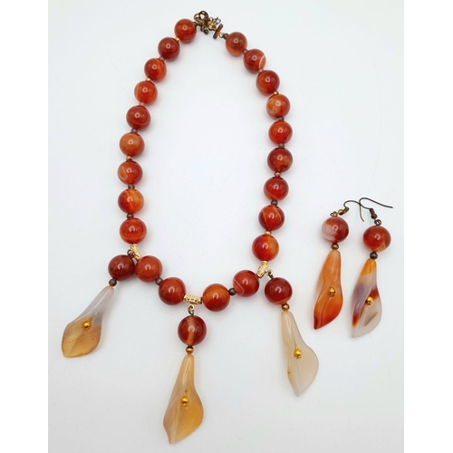 140 - A vintage carnelian necklace and earrings set with carved Arum lilies pendants (often cale Cala lili... 