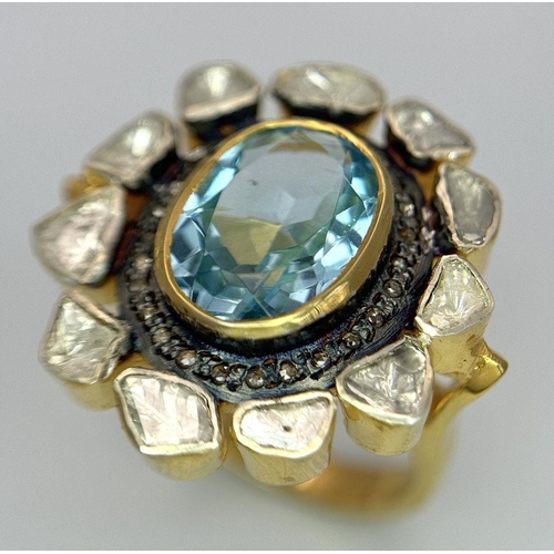 142 - A Blue Topaz and Diamond Ring. A central oval cut sky blue 3ct topaz with a twin diamond surround. O... 