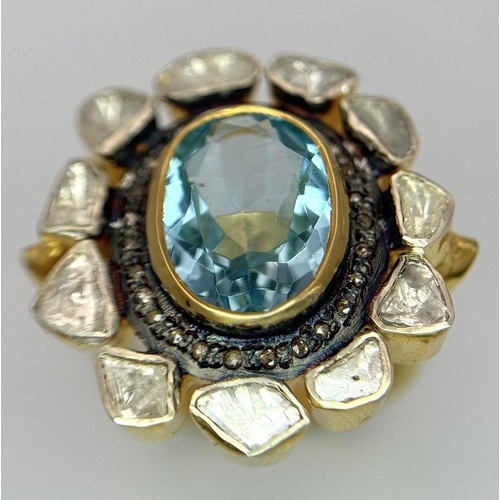 142 - A Blue Topaz and Diamond Ring. A central oval cut sky blue 3ct topaz with a twin diamond surround. O... 