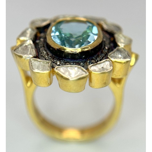 142 - A Blue Topaz and Diamond Ring. A central oval cut sky blue 3ct topaz with a twin diamond surround. O... 