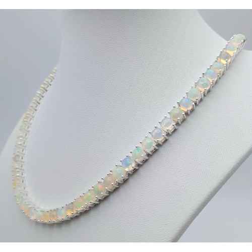 148 - An Ethiopian Fire Opal Tennis Necklace - set in 925 Silver. CD-1489. 45cm length.