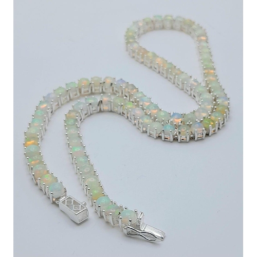 148 - An Ethiopian Fire Opal Tennis Necklace - set in 925 Silver. CD-1489. 45cm length.